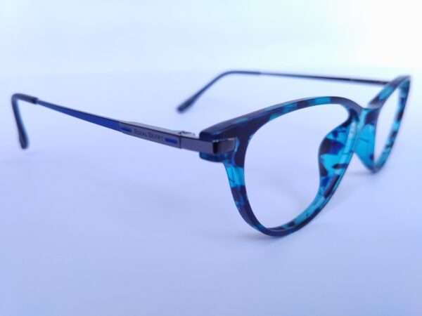 Blue black oval eyeglasses with a sleek metal-acetate frame, lightweight comfort, and modern appeal for men and women.