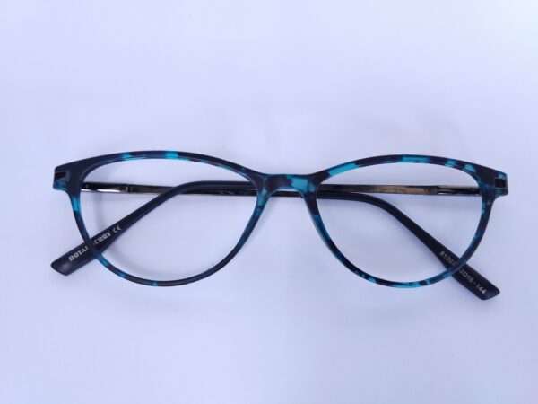 Blue black oval eyeglasses with a sleek metal-acetate frame, lightweight comfort, and modern appeal for men and women.