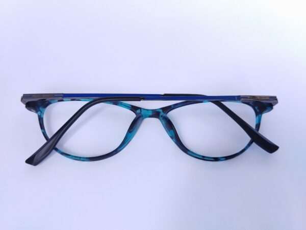 Blue black oval eyeglasses with a sleek metal-acetate frame, lightweight comfort, and modern appeal for men and women.