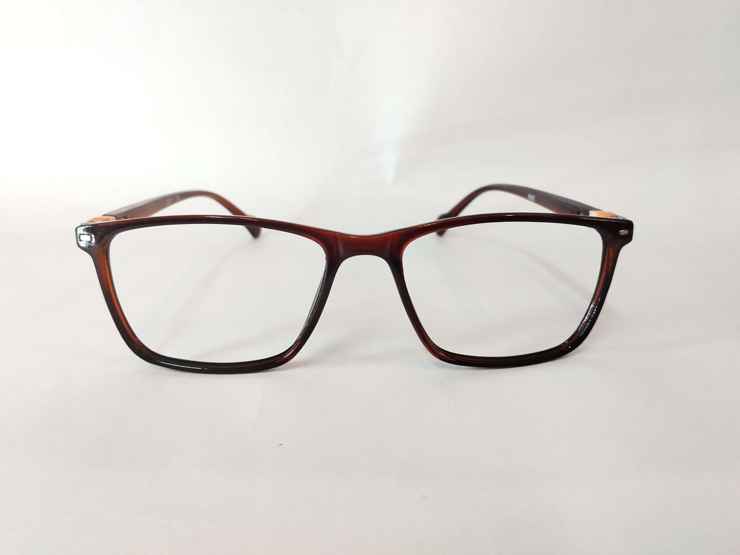 Glossy dark brown eyeglass frames with yellow and white lines