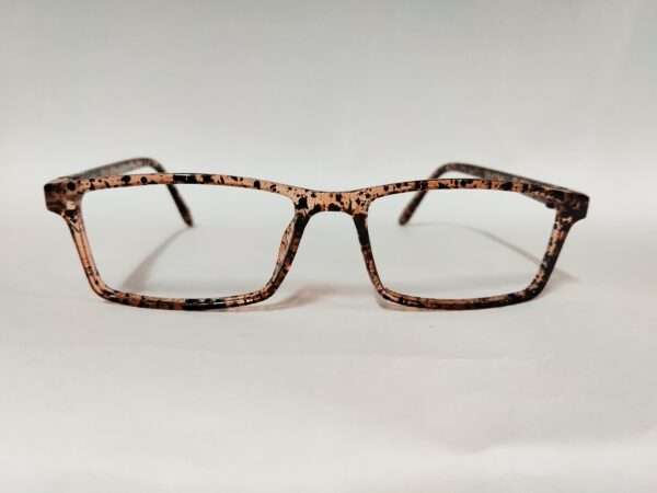 Glossy light brown and black eyeglass frame with a bold tiger-stripe pattern, featuring a modern and stylish design