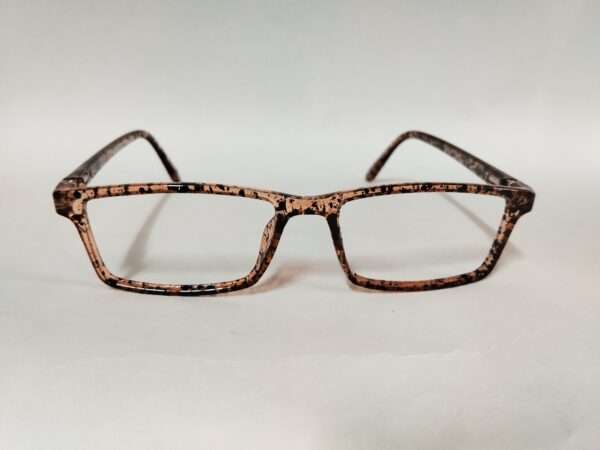 Glossy light brown and black eyeglass frame with a bold tiger-stripe pattern, featuring a modern and stylish design