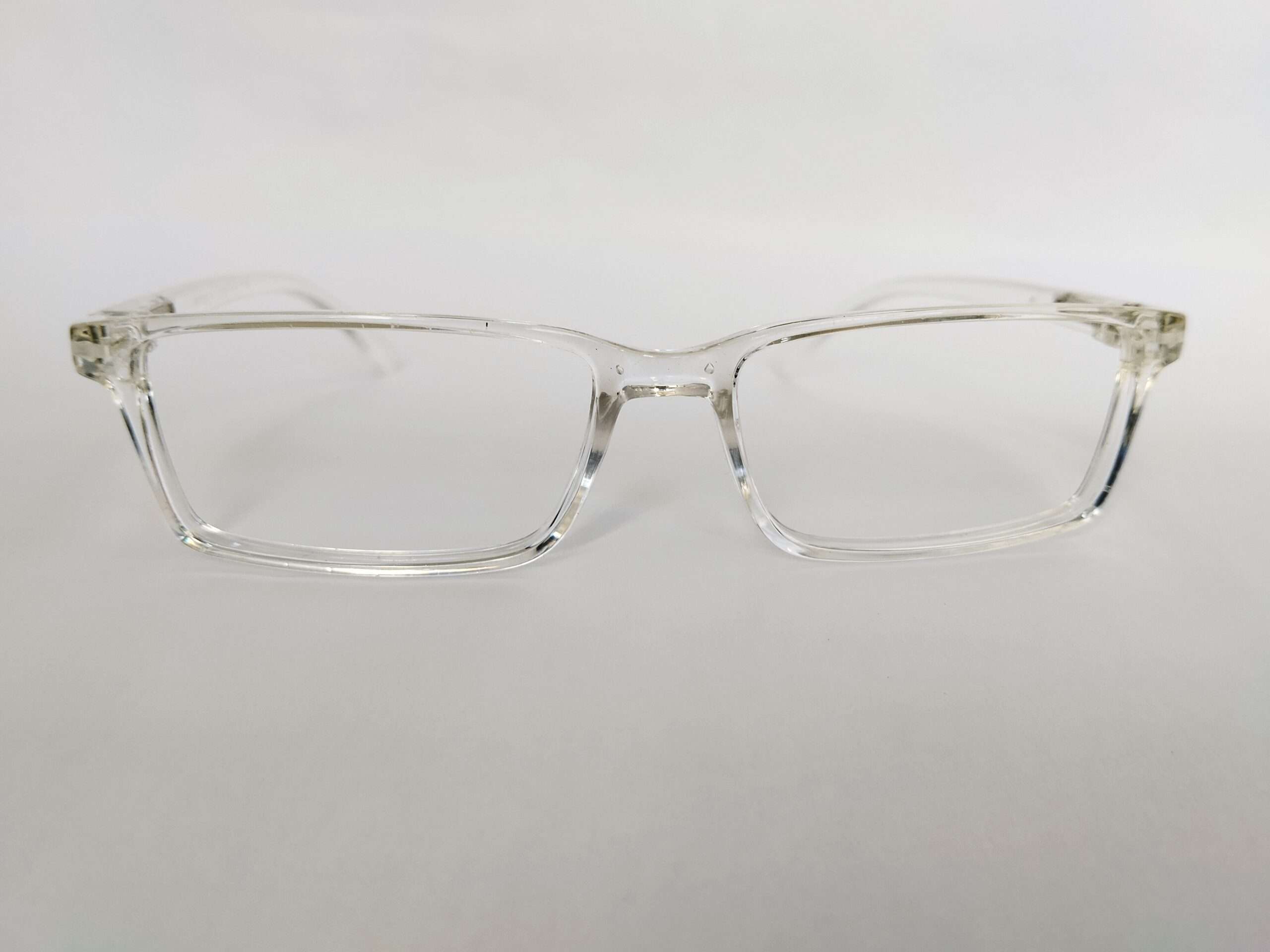 Glossy crystal clear rectangle eye glasses frames with transparent modern design
