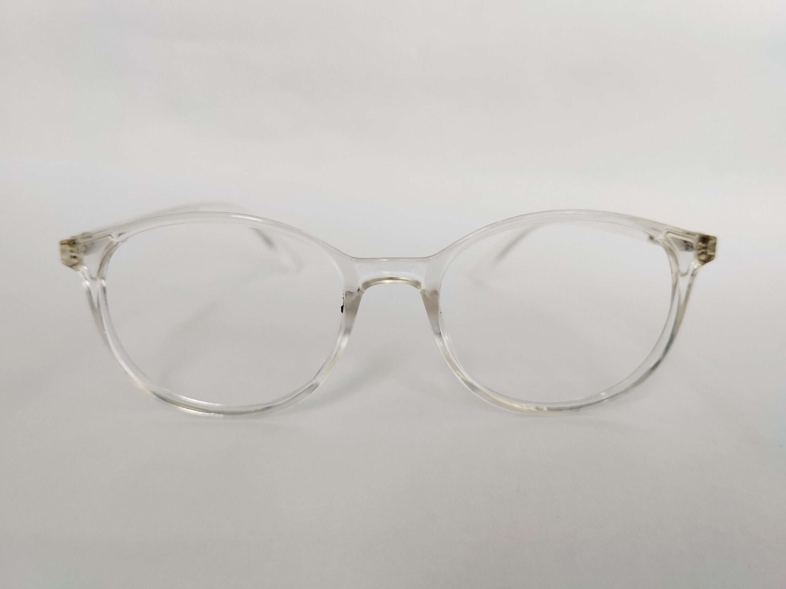 Glossy crystal clear oval eye glasses frames with transparent modern lightweight design