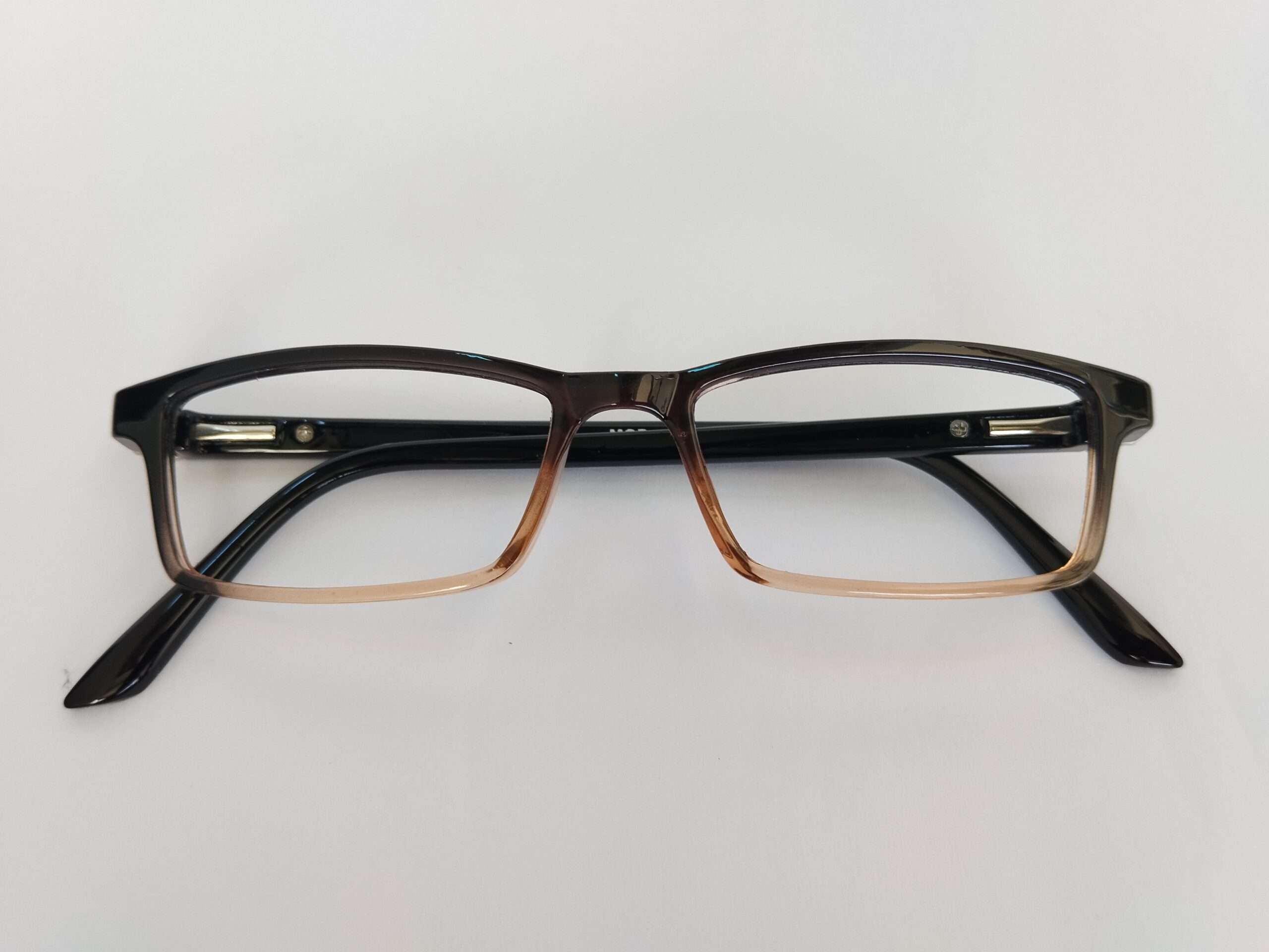 Black brown small computer eye glasses with compact dual-tone frame and modern lightweight design.