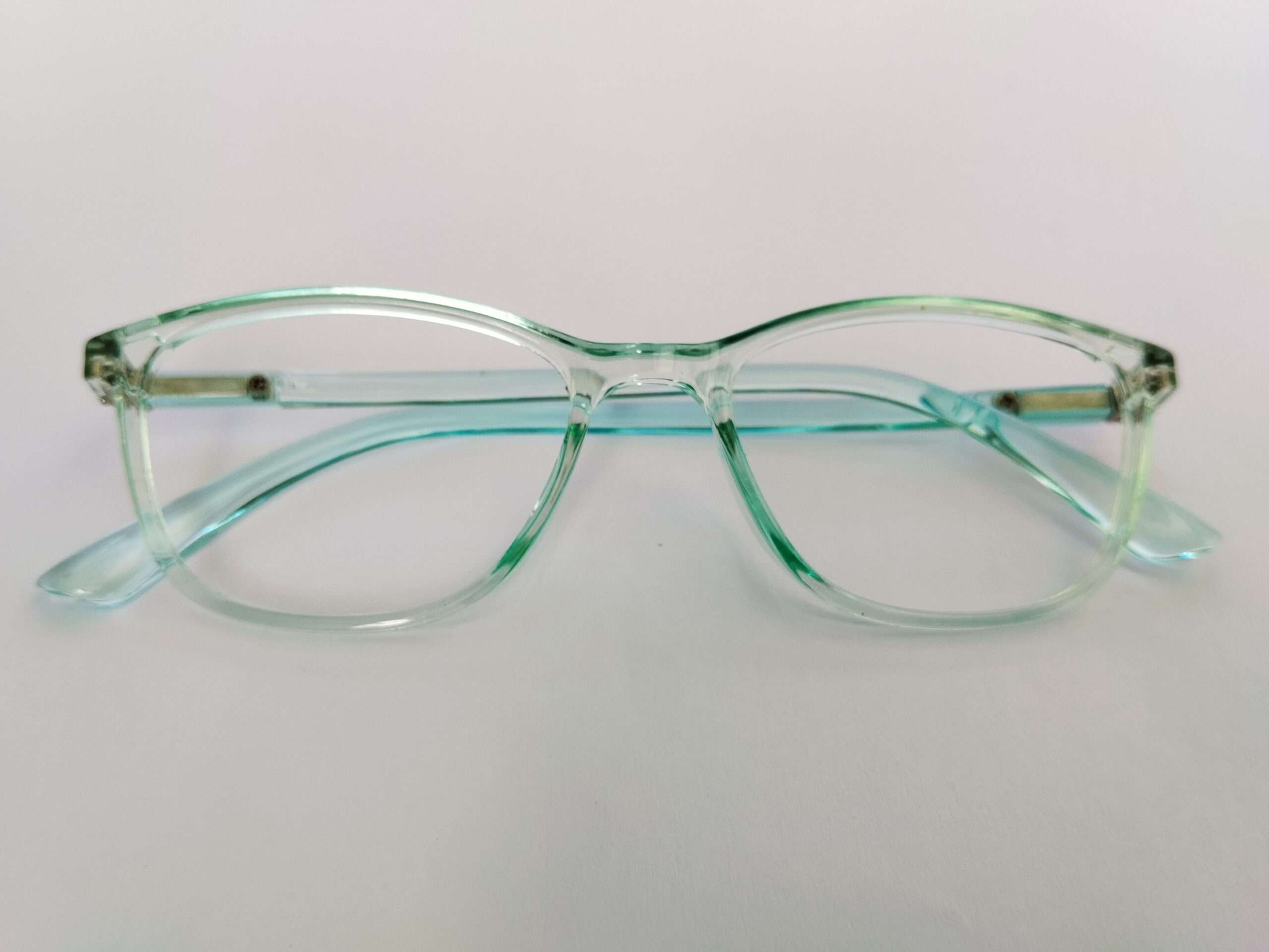 Sky blue computer rectangle glasses with modern slim frame and soft matte finish.