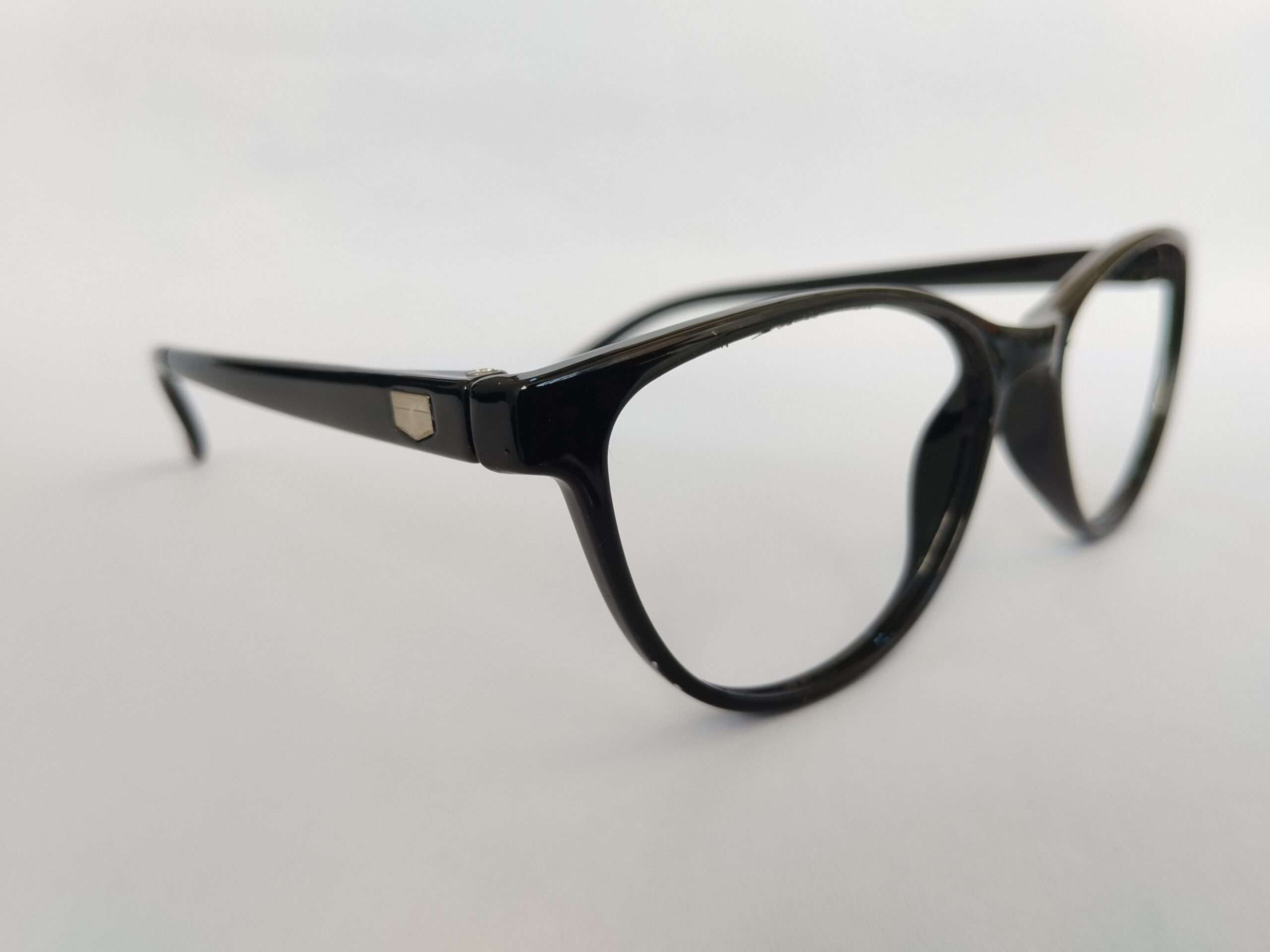 Black womens cat eye glasses with sharp upswept edges and modern glossy finish