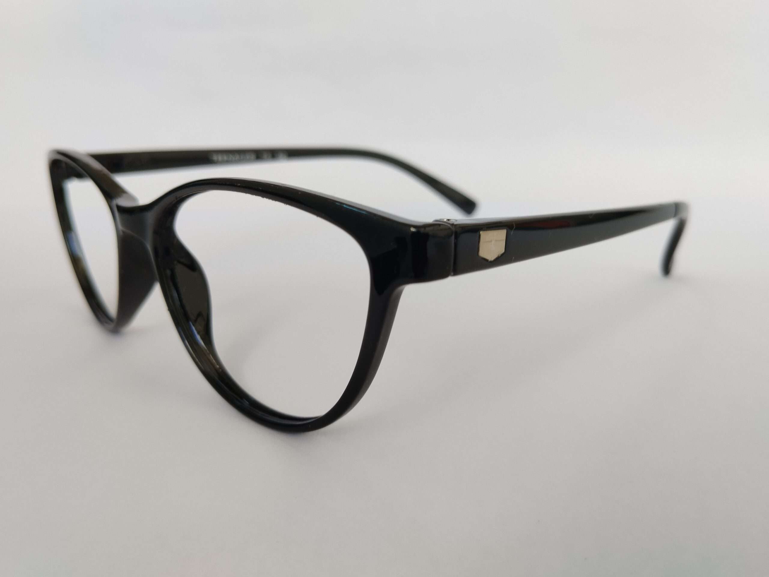 Black womens cat eye glasses with sharp upswept edges and modern glossy finish