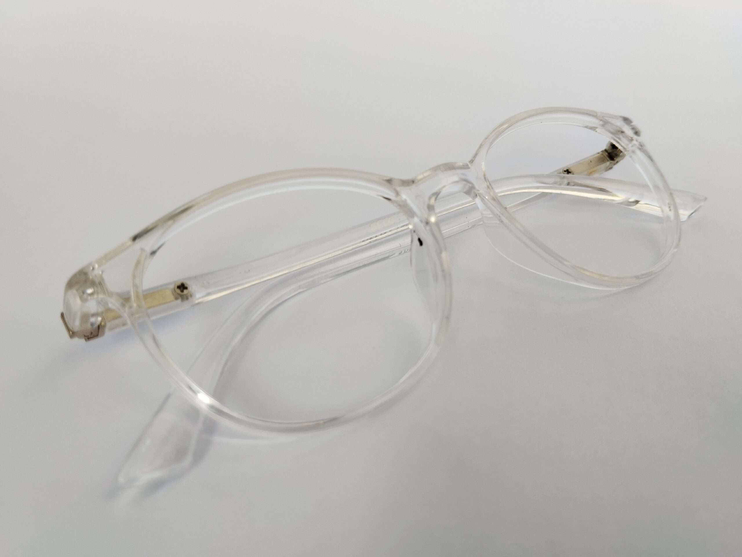 Crystal clear small oval prescription glasses with transparent lightweight design