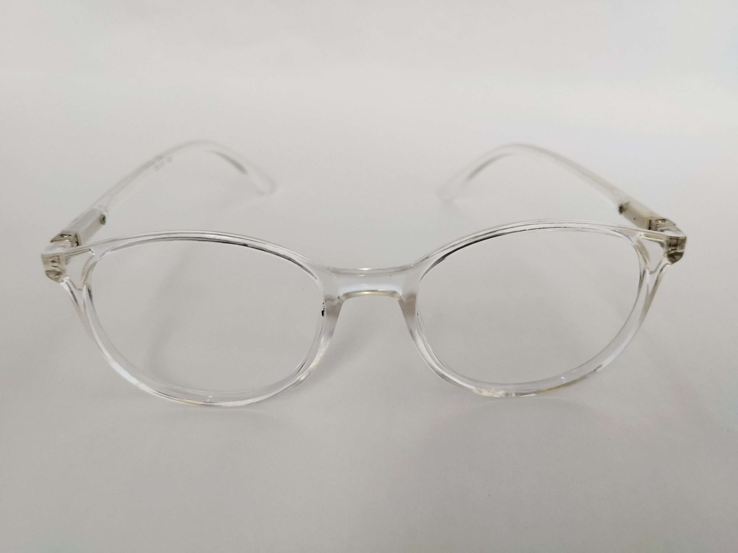 Crystal clear oval reading glasses with lightweight transparent frame design