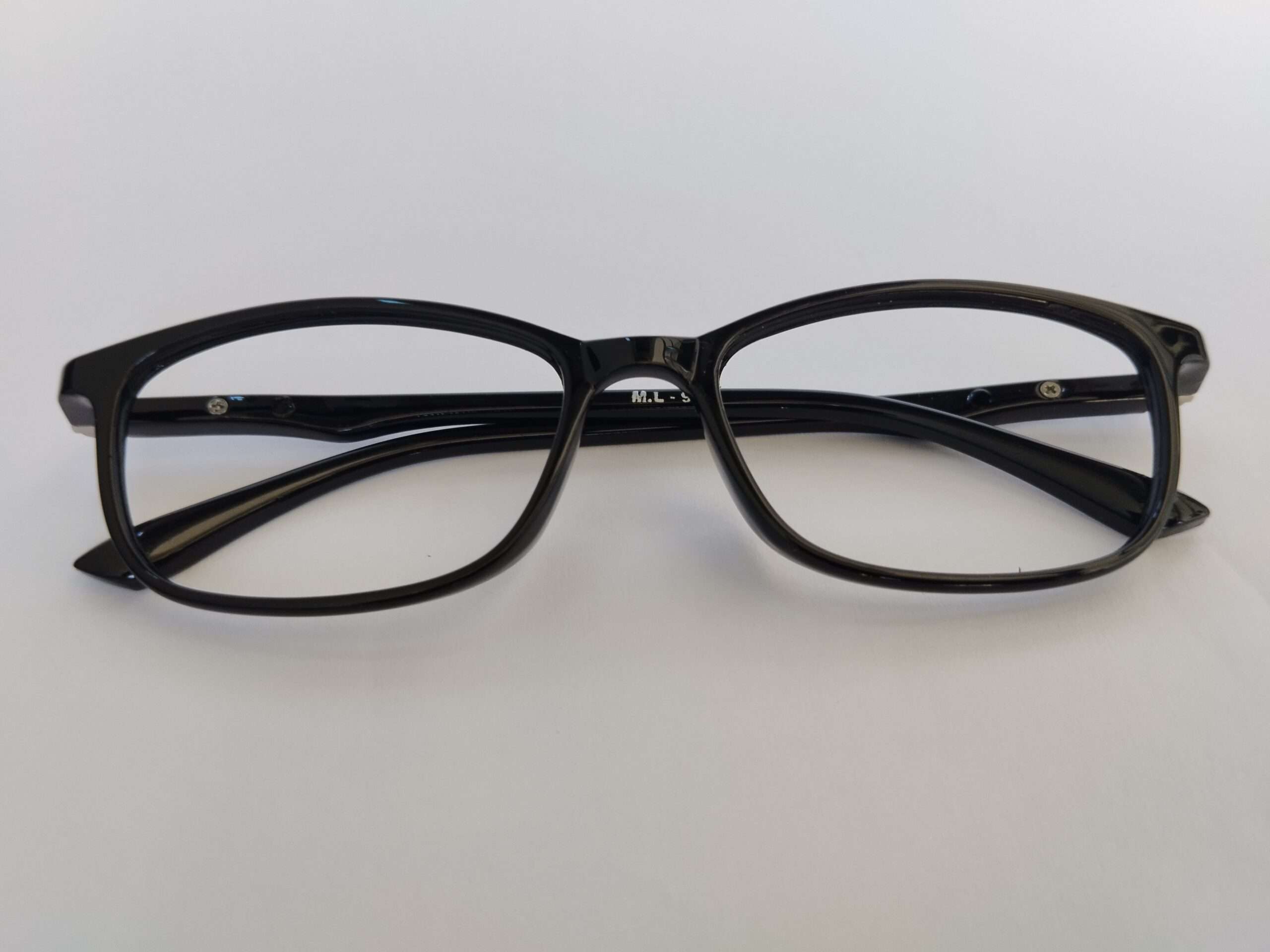 Black rectangle reading glasses with modern lightweight design and sharp edges