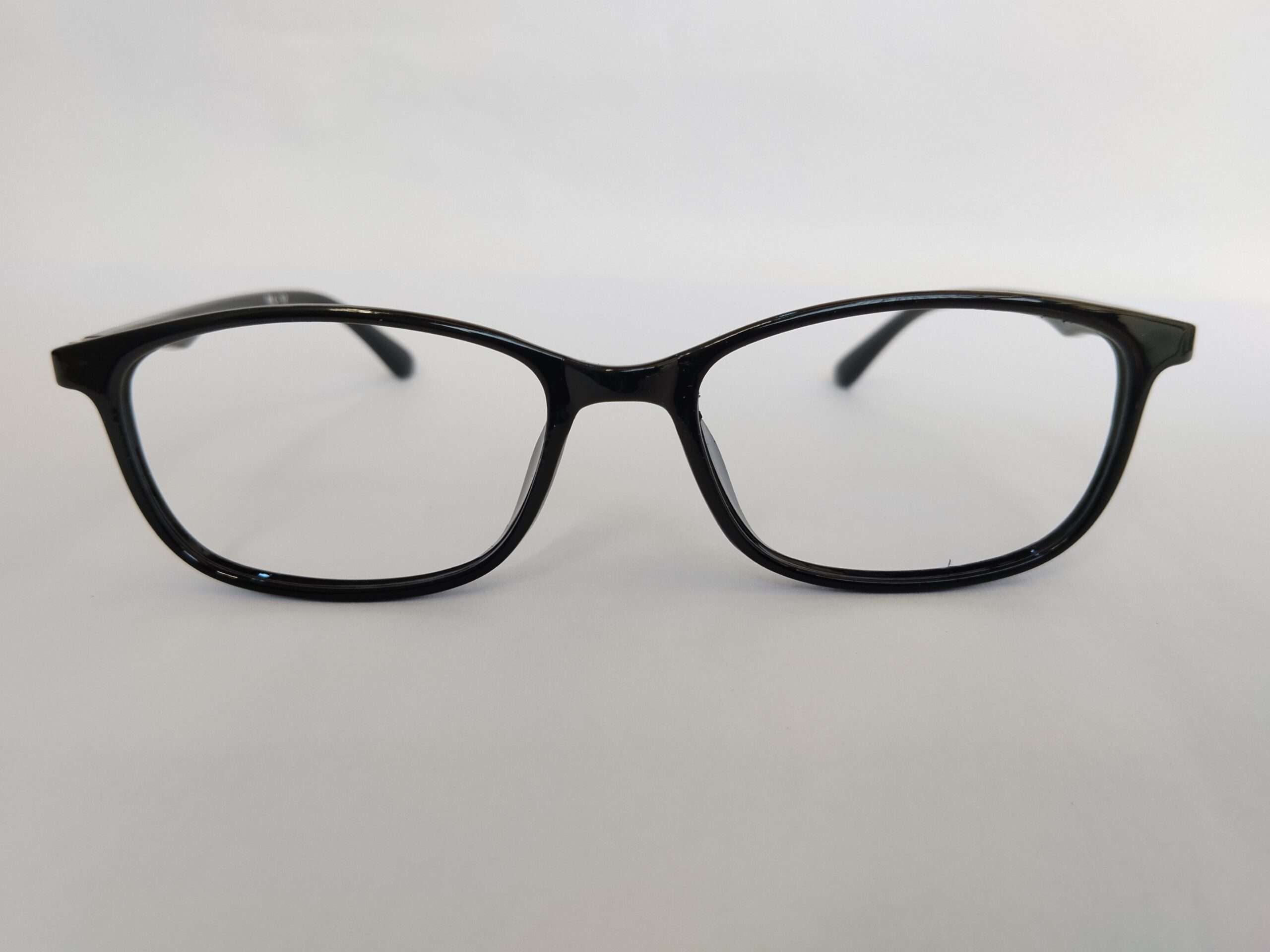 Black rectangle reading glasses with modern lightweight design and sharp edges