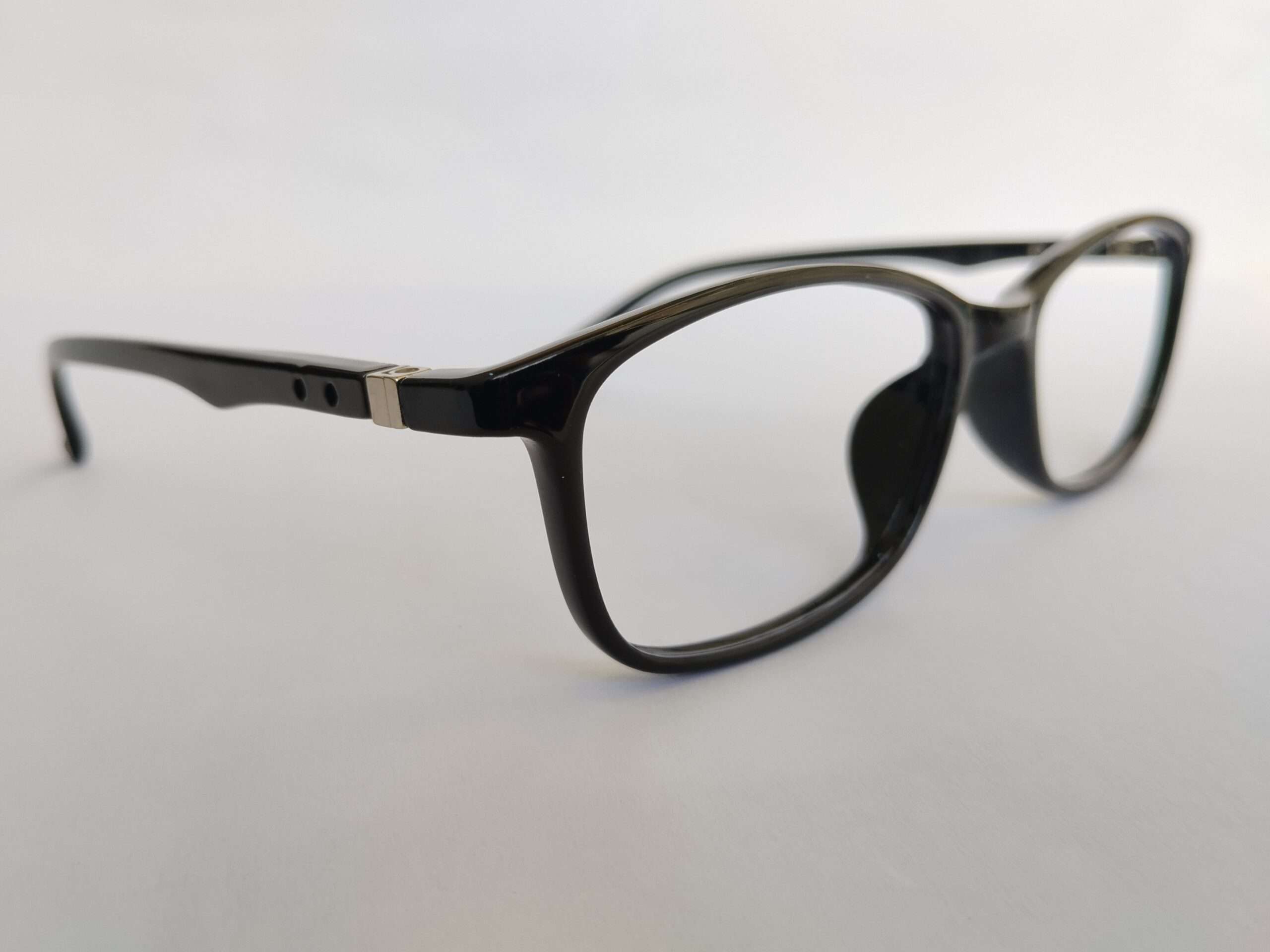 Black rectangle reading glasses with modern lightweight design and sharp edges